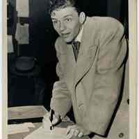 Sinatra photo: Frank Sinatra signing document at Local Draft Board No. 3, 160 Danforth St., Jersey City , N.J. Dec. 9, 1943.