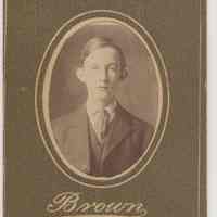 Sepia-tone photo of an unidentified boy posed in studio, Hoboken, no date, ca. 1890-1910.