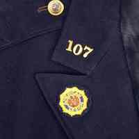          detail right lapel with button; post number; small patch
   