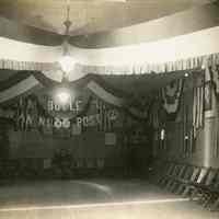 B+W photo of a hall decorated with bunting, swagging & lettered signage by United Decorating Company of Hoboken, probably in Cliffside Park, N.J., n.d., ca. 1930s.