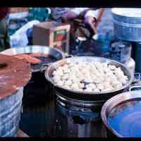 Color slide of a food stall at a street fair.