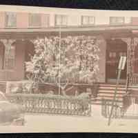 Photo of the front yard and porch of 68 10th Street.