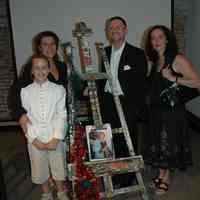 Color photos, 2, of artist Robert Burczy with family on day of his lecture, Hoboken Historical Museum, June 10, 2006.