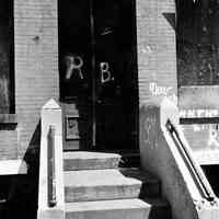 B+W photo of the front stoop and doorway of a Hoboken apartment building, street address not known, no date (ca. 1968-72)