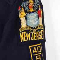          detail leat sleeve with three patches
   