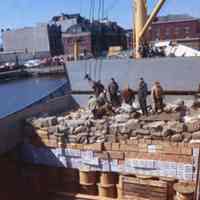 Image: color transparency of several longshoremen standing in the hold of a ship moored on the south side of Pier A, Hoboken, May, 1979.