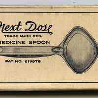          box / sleeve front with spoon partially out
   