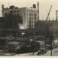 Sepia-tone photo of steel frame erection on the site for the Fabian Theatre, southeast corner of Newark & Washington Sts., Hoboken, Feb.21, 1928.