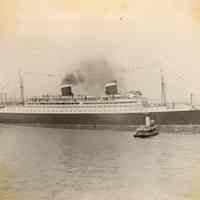 Image: S.S. Manhattan, United States Lines, with tugboat at unidentified pier, no date, ca. 1932-39.