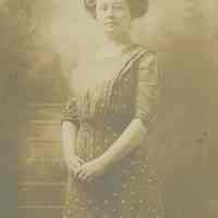Photo postcard of an unidentified young woman, probably Florence Miller, posing in an unknown photo studio, no place, no date, ca. 1900-1910.