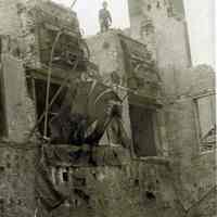 Sepia-tone photo of exterior view of the aftermath of fire at John Schmalz
