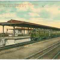 Digital image of Hudson & Manhattan R.R. postcard titled: Manhattan Transfer Station showing Rapid Transit Train, N.Y. to Newark. n.d., ca 1913.