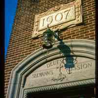          Color slide of close-up view of portico frieze reading 