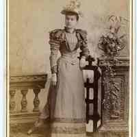 Cabinet photo of young woman posed in photographer