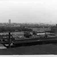 B+W photo of view looking southeast of factory buildings on Monroe & Jefferson Sts. from 10th St.; Veterans Field, Columbus Park, Hoboken, n.d., ca. 1969-1970.