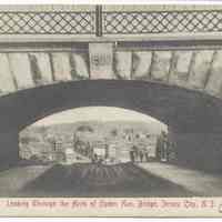 Postcard: A 9606. Looking Through the Arch of Ogden Ave. Bridge, Jersey City, N.J. Postmarked circa July 6, 1909.