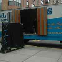 Color photos, 4, of 100 Hoboken Firsts exhibition being loaded on moving van at Museum, Hoboken, July 12, 2006.