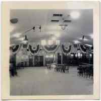 B+W photo of a hall decorated with bunting by United Decorating Co. of Hoboken, Hoboken?, n.d., ca. 1935-1950.