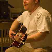          Color photos, 3, of poet Joe Weil with guitar during reading at Hoboken Historical Museum, April 23, 2006. picture number 1
   