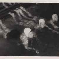 B+W photo of 3 girls in swimming pool at Hoboken Y.M.C.A., Hoboken, n.d., probably 1957.