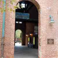          09 southeast entrance to walkway with bronze wall plaque
   