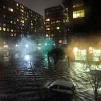          Superstorm_sandy_joe_epstein103; flooded streets; building lights still on
   