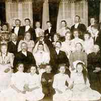 Digital image of a group wedding photo for Carl Pfeil and wife, no place (Hoboken?), January 4, 1908.