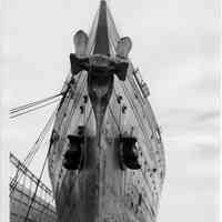 B+W photo of a head-on bow view of the Leviathan at its Hoboken pier, Hoboken, ca. Jan. 10 to 12, 1938.