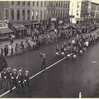 Digital image of b+w photo of American Legion Post 107 (Hoboken) Drum & Bugle Corp marching on Washington St., Hoboken, no date, ca.1948.