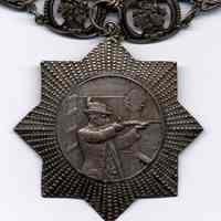          front detail, bottom medal
   