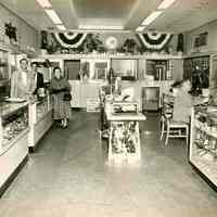 B+W photo of Nathan Marcus & store staff inside Marcus Jewelers, Hoboken, April 2, 1954.