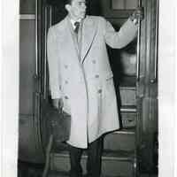 B+W photo of Frank Sinatra stepping off a passenger train car, no place (Chicago?), n.d., ca. 1940-1944.