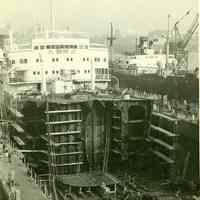 B+W photo of the reconstruction of the forward section of an unidentified freight vessel in dry dock, possibly in Hoboken, no date, ca. 1940.