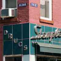 Color photo of building facade with sign for Stemple Pharmacy, 266 Seventh St. at Willow Avenue, Hoboken, Sept., 1-5, 2001.