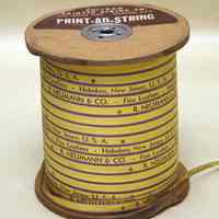 Spool of printed ribbon: R. Neumann & Co., Fine Leathers, Hoboken, New Jersey, U.S.A. No date, ca. 1960