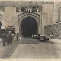 B+W photo of official cars coming out of Lincoln Tunnel, Weehawken, Dec. 21, 1937.