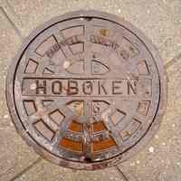 Color photo of sewer (manhole) cover from 1956, Hoboken, Feb. 2014.