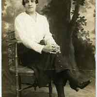 Sepia-tone photo of woman posed seated in studio, Hoboken, n.d., ca. 1918-1930.