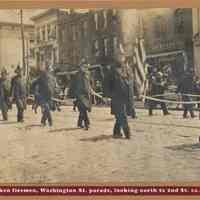 Sepia-tone of Hoboken firemen marching in Washington St. parade looking north to Second St., Hoboken, ca. 1900-1905.