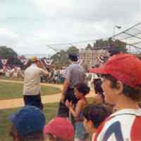 Color photo of audience and participants at Baseball Day Ceremonies, 1976.