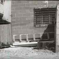 B+W photo of debris and rubbish at 11th and Madison Streets with trucks in the background, Hoboken, no date, ca. 1970-1980.