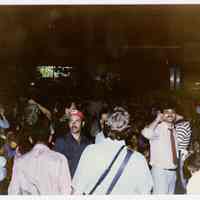 Color photo of supporters of mayoral candidate Tom Vezzetti in front of City Hall on election night, Hoboken, [June 11, 1985].