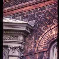          Color slide of detail view of portico semicircular arch, decorative tiles, and frieze at 105 4th between Washington and Bloomfield picture number 1
   