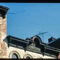          Color slide of close-up view of cornice, pediment and frieze reading 