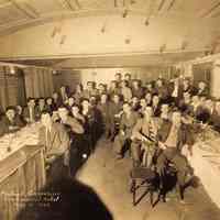 Digital image of sepia-tone group photo of men at Patrick Capperino dinner at the Continental Hotel, Hoboken, May 21, 1942.