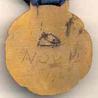          back of medal dated Nov 12 1927; maker's marks
   