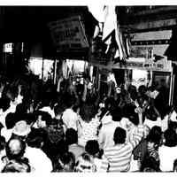 B+W photo of Tom Vezzetti supporters outside his campaign headquarters, 536 Washington St., on election night, Hoboken, [June 11, 1985].