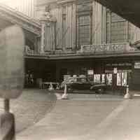 Black-and-white photo of parking and entrance to the railroad Waiting Room, Lackawanna Terminal, Hoboken, January 30, 1949.