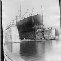 B+W photo of a bow view of the S.S. American Farmer in dry dock, steerage removed, Hoboken, no date, ca. 1940.