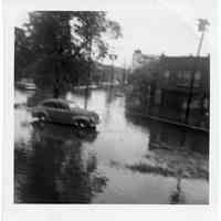 B+W photos, 2, of Hurricane Connie aftermath at / vicinity of 65 Paterson Ave., Hoboken, Aug. 4, 1955.